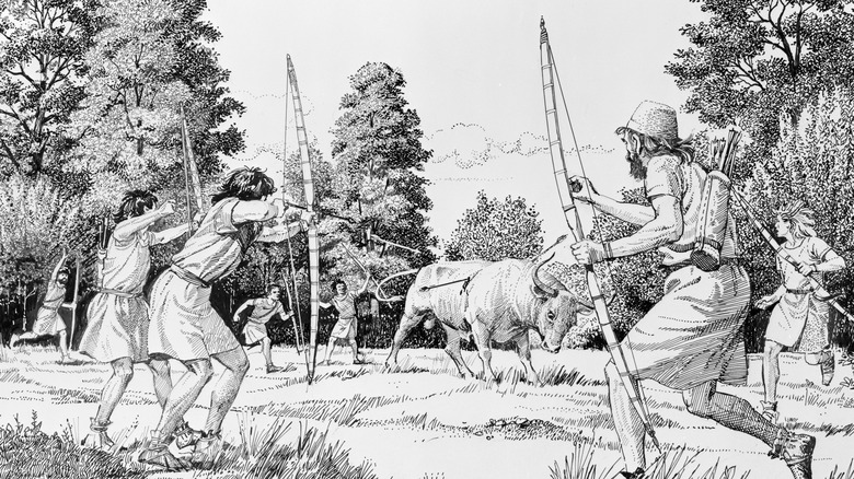 Cazadores prehistóricos cazando un uro